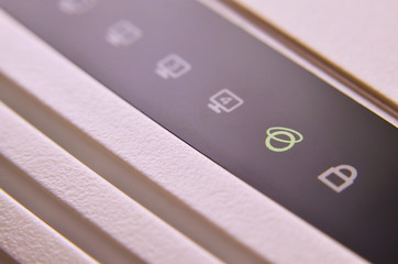Closeup of internet router LED lights showing connection status. Emitting diode wireless on white...