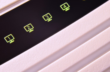 Closeup of internet router LED lights showing connection status. Emitting diode wireless on white...