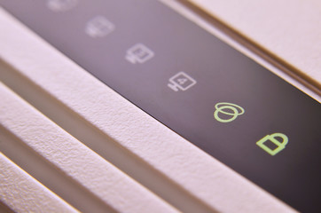 Closeup of internet router LED lights showing connection status. Emitting diode wireless on white...
