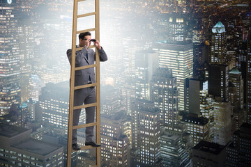 Businessman with binoculars looking into future