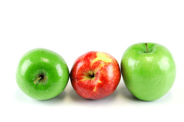 green and red apples on white background