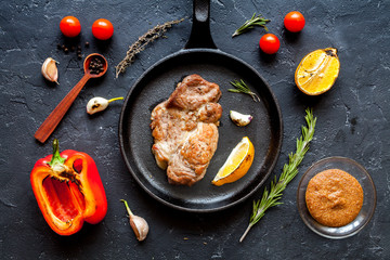 concept cooked steak on dark background top view