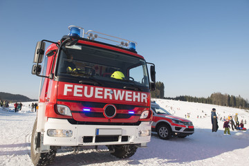 Fototapeta na wymiar Paramedics and Ambulance in Winter Scenery 4