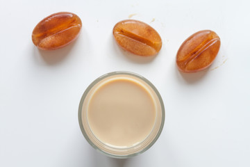 coffee with ice in glass top view on white background