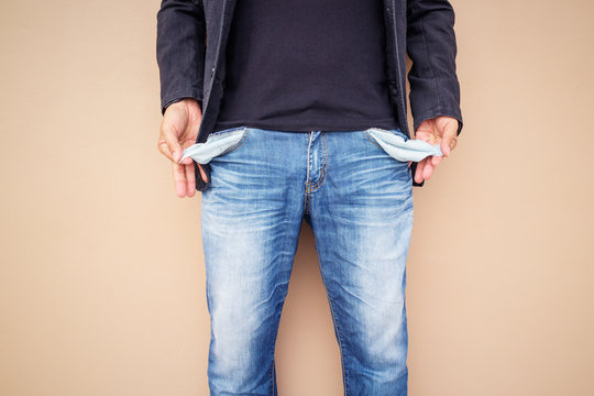 Man showing his empty pockets