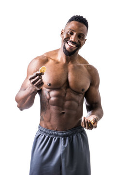 Shirtless Muscular Young Man Eating Rice Cracker, Looking At Camera Standing, Isolated On White Background