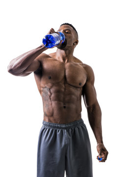 Muscular Shirtless Black Male Bodybuilder Drinking Protein Shake From Blender. Isolated On White, Looking Up