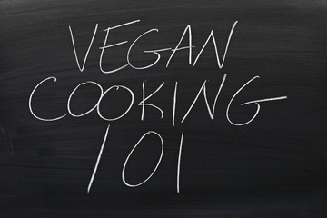 The words "Vegan Cooking 101" on a blackboard in chalk