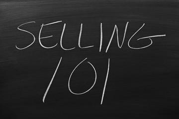 The words "Selling 101" on a blackboard in chalk