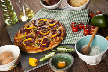 Delicious pizza served on wooden table