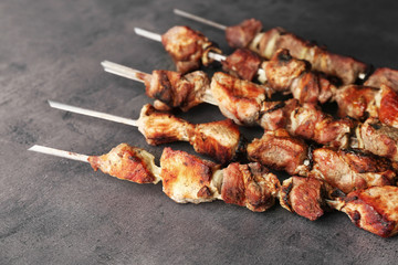 Fresh tasty barbecue on grey background