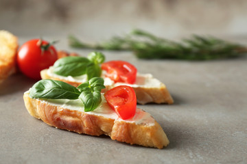 Tasty bruschettas on grey background