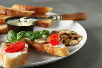 Tasty bruschetta on plate, closeup