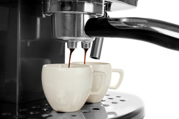 Coffee machine making espresso, closeup