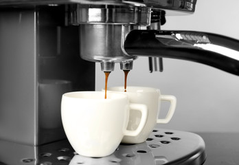 Closeup of making aromatic espresso in coffee machine