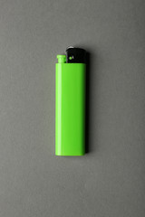 Blank green cigar lighter on grey background
