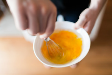 Overhead shot of man scrambling eggs