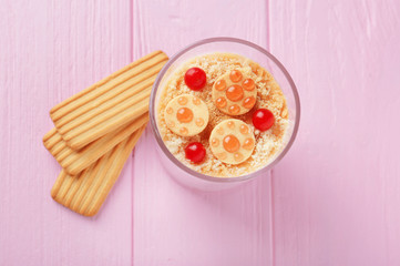 Baby cookies and milk cocktail on wooden background