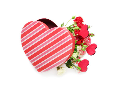 Heart shaped gift box with flowers on white background
