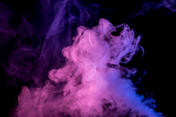 Abstract smoke Weipa. Personal vaporizers fragrant steam. The concept of alternative non-nicotine smoking. Blue lilac smoke on a black background. E-cigarette. Evaporator. Taking Close-up. Vaping.