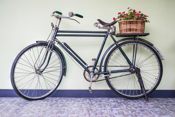 Fototapeta na wymiar Old Bicycle against a Wall