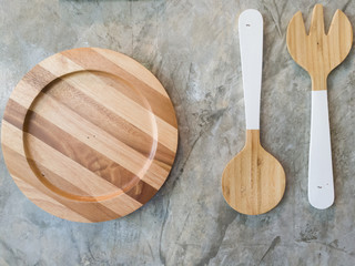 Top view of wooden plate fork spoon