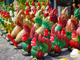 Colorful of a many cock statues, Roosters are placed around the temple dedicated to god of Thailand