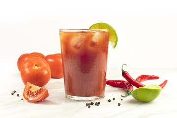Bloody Mary cocktail with lime and tomatoes