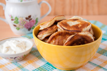 Delicious pancakes for breakfast in yellow plate