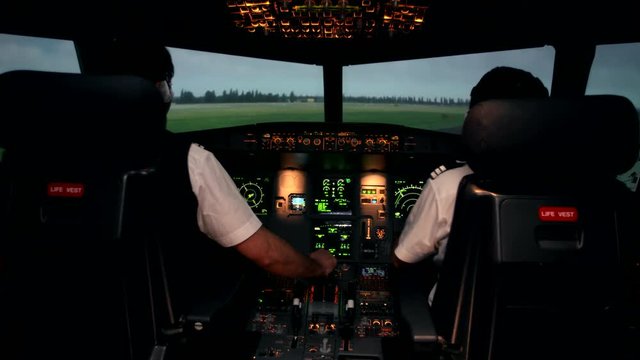 Workplace of aircraft pilots. Cockpit or flight deck of a modern passenger airplane with cabin crew. All is ready to departure. Airbus A319 A320 A321