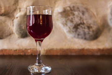 Glass of red wine om a teble
