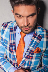 closeup portrait of a young man in checkered suit