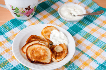 Delicious pancakes with sour cream for breakfast