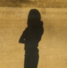 shadow  woman on dirty wall.