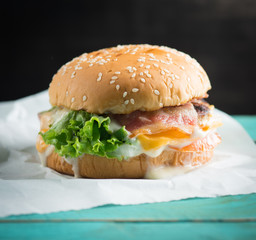 Fresh homemade burger cheeseburger on blue wooden