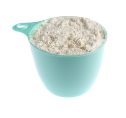 measure cup of white flour for baking  isolated on a white background