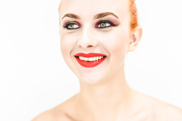 Fototapeta premium A woman on a light background looking away and smiling