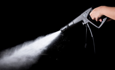  Water splashes with high pressure water jet on black background