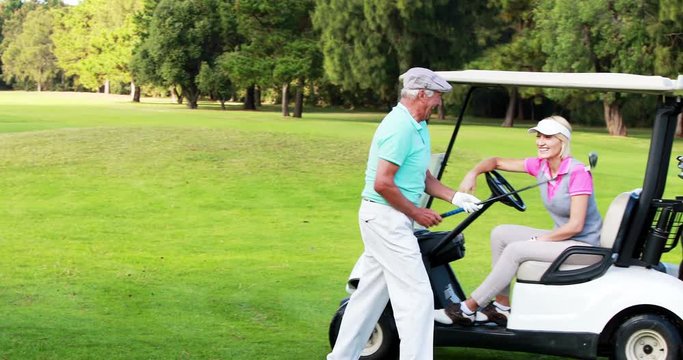 Two golfer players interacting with each other at golf course 4k