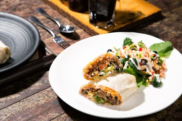 portrait of mexican burritos prawn queiro served with salsa 