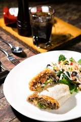 portrait of mexican burritos prawn queiro served with salsa 