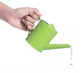 Obraz premium Water pouring from green watering can isolated on white background