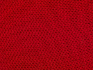 red texture of a sweeter, close up, copy space 