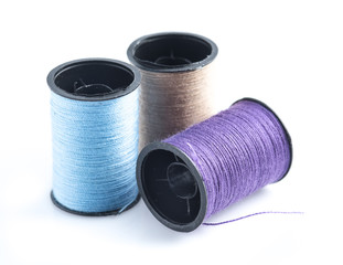 Colorful sewing Threads isolated on white background