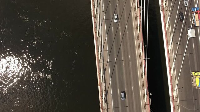 Top view at the road lanes on span of the cable stayed brige. Camera flying across highway. St. Petersburg, Russia
