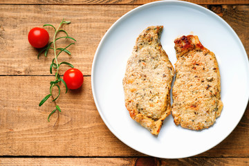 Fried pork meat and tomatoes