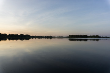 Beautiful sunrise on the lake and blue sky