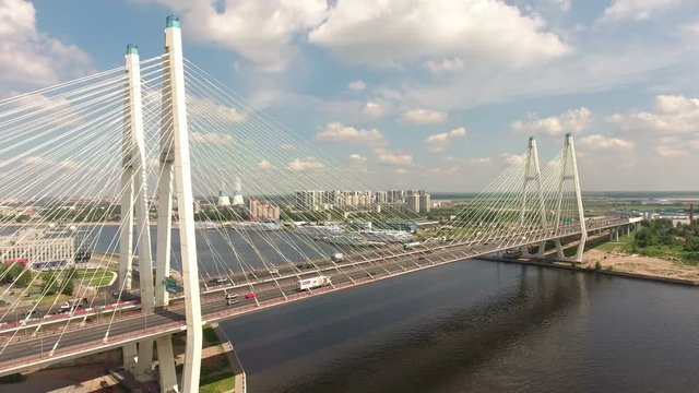 Aerial view at the cable-stayed Bolshoy Obukhovsky Bridge with city ringroad. Neva river, St. Petersburg, Russia
