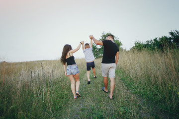 young family with a child have fun outdoors