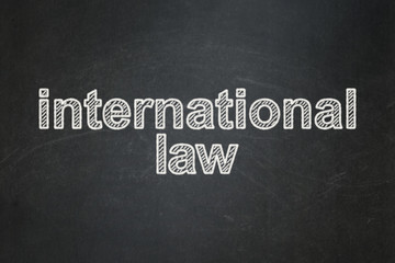 Political concept: International Law on chalkboard background
